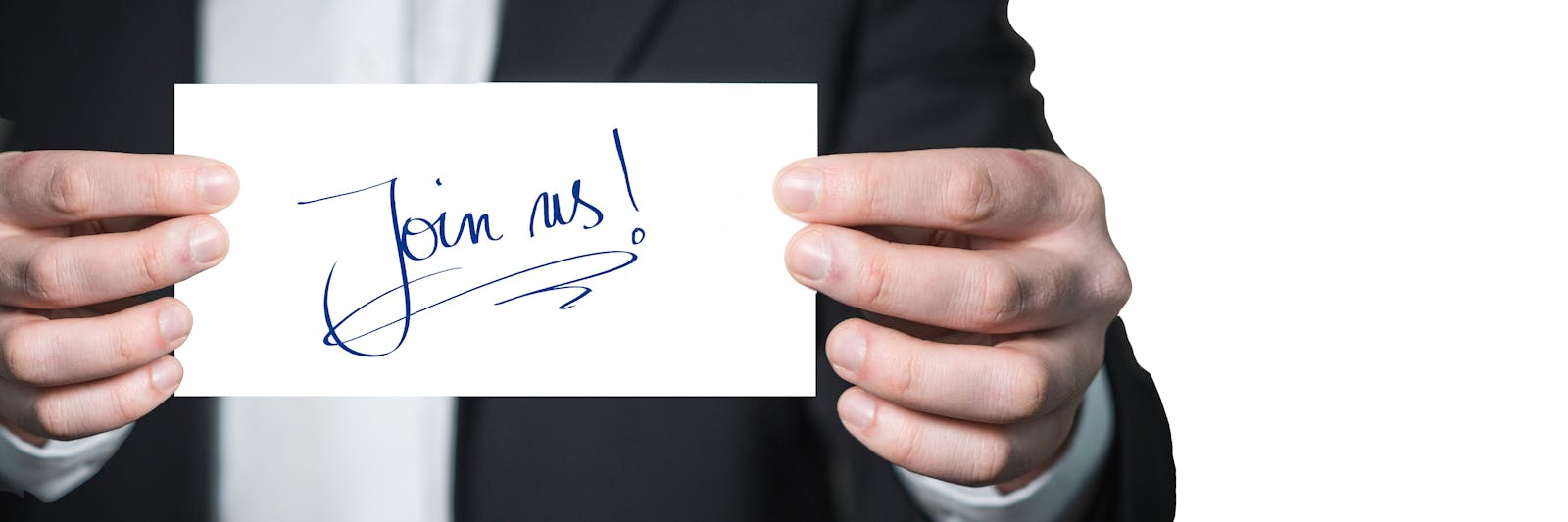 Small business owner reviewing paid social ad results with cost-per-lead figures on screen