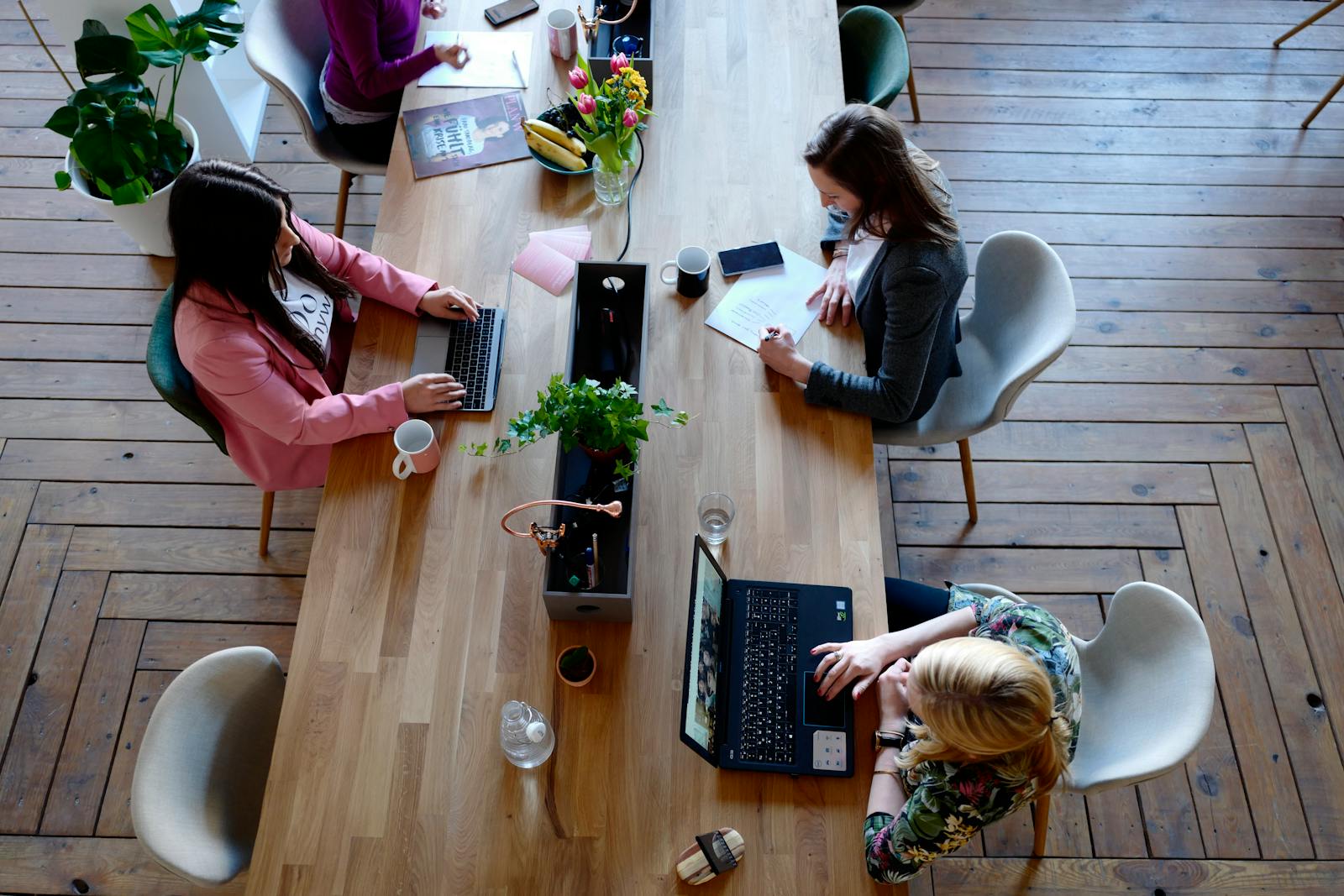 Flat lay of a content calendar and phone planning social media posts
